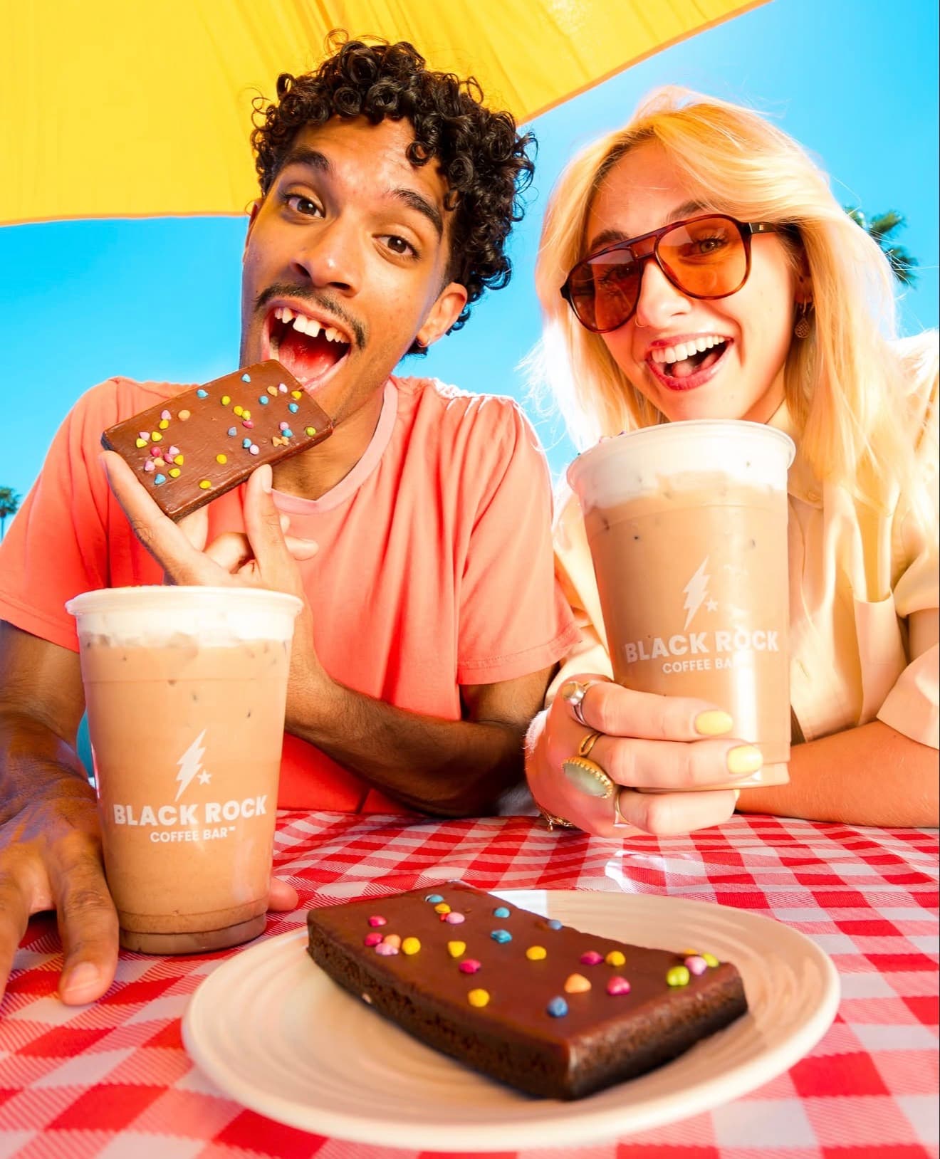 Hannah Warren in a colorful Black Rock Coffee Bar campaign image.